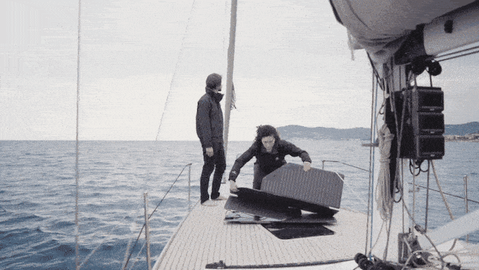 Unfolding the origami-like Levante solar panels on the deck of a boat. 