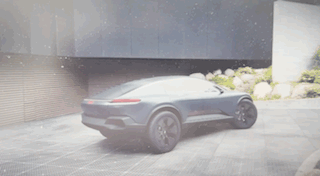 A video showing the outward opening doors revealing the living sphere within the car along with the opening bed of the car. 