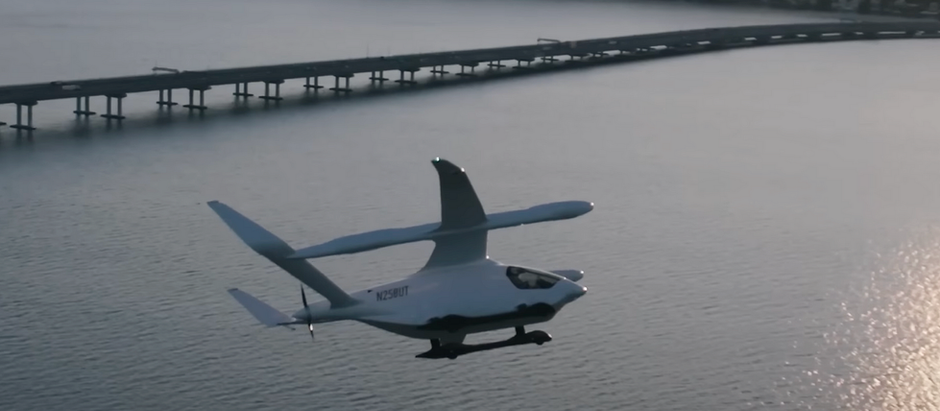 A view of an ALIA electric aircraft flying over open water 