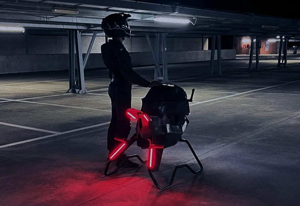 A Volonaut Airbike owner standing near it as its lights are ablaze