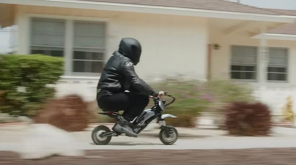 A rider sitting on his Splach Transformer while traveling.