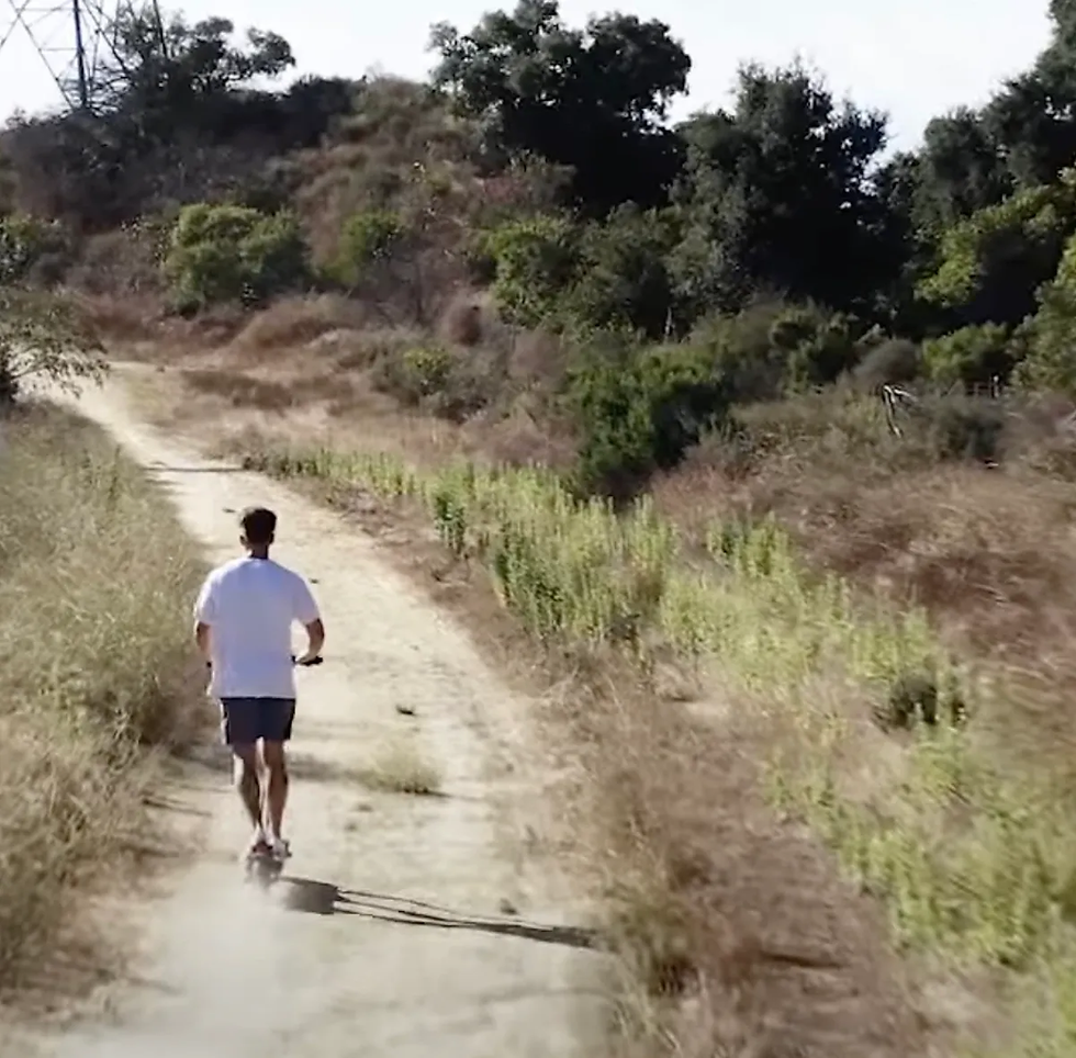 A Thunder electric scooter rider taking a steep incline ride.