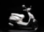 An overall view of the Vespa Elettrica upon a black background.