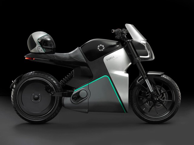 A side-view of the Fuell Fllow electric motorcycle with a helmet placed on the saddle seat.