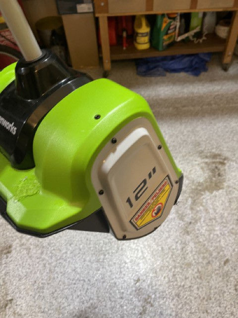 A closer look at the side of the powered snow shovel