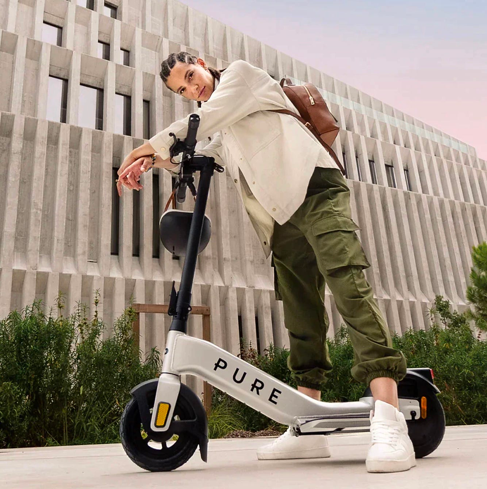 A view of a rider on their Pure Advance Flex electric scooter.