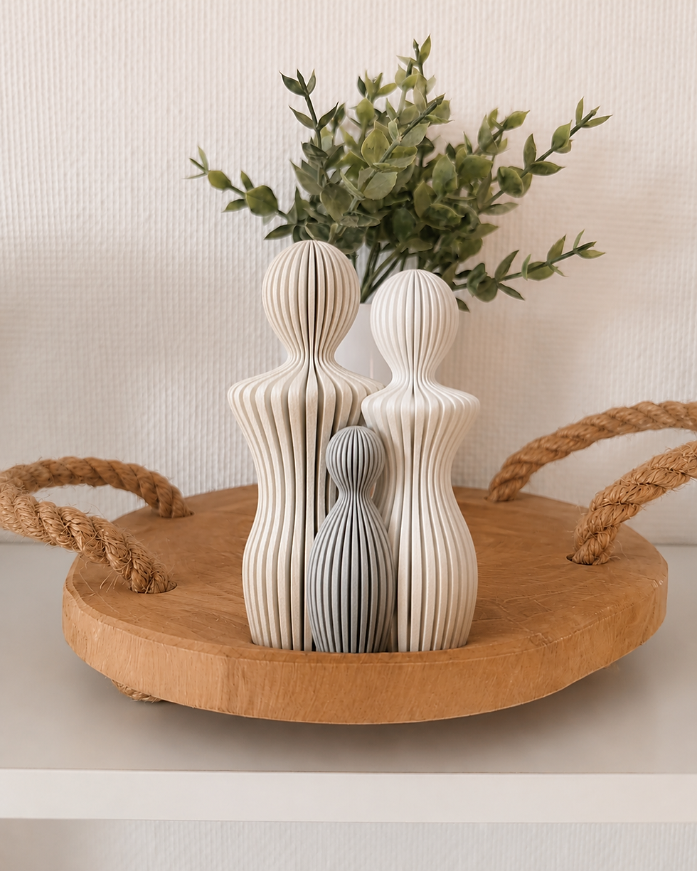 Custom ribbed family sculpture with couple and child figures