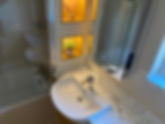 A bathroom sink with a mirror