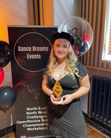 teen holding her award