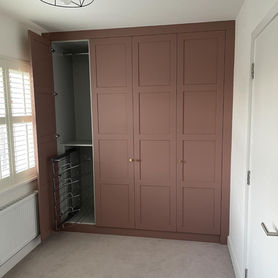 one door open, pink fitted wardrobe