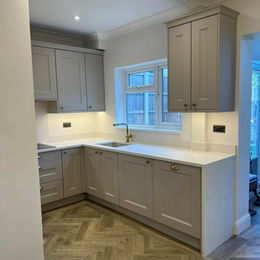 kitchen sink and newly installed kitchen cabinets