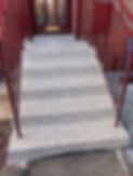 resin steps with red hand rail and door