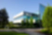 commercial building with trees and bushes