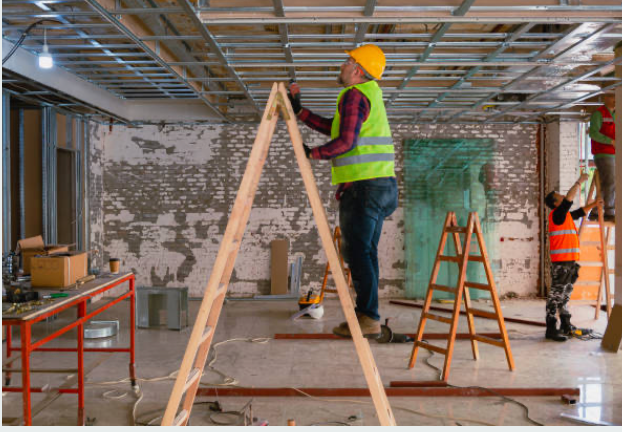 Construction worker on ladder