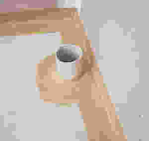 start with the agent around the wall and floor area then roller the whole of the floor and up to 1.8m high in shower area