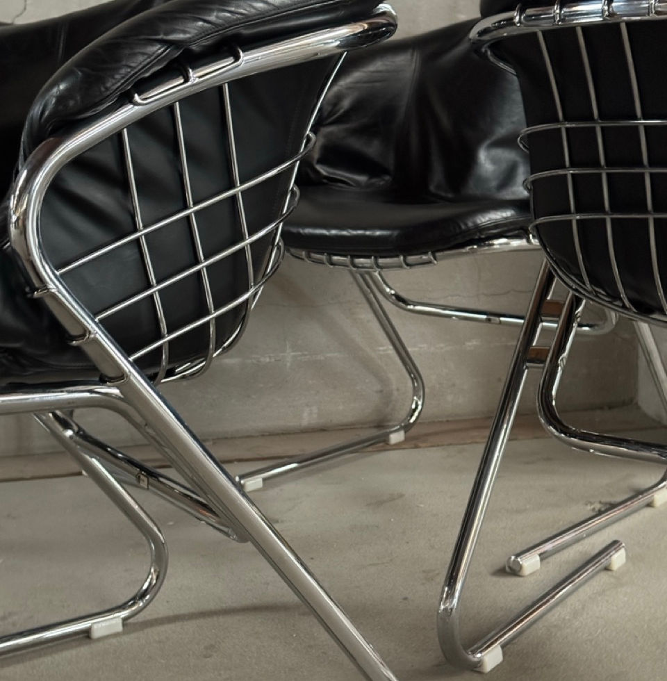 Detail view of the chrome cantilever base on the 1970s Italian chairs