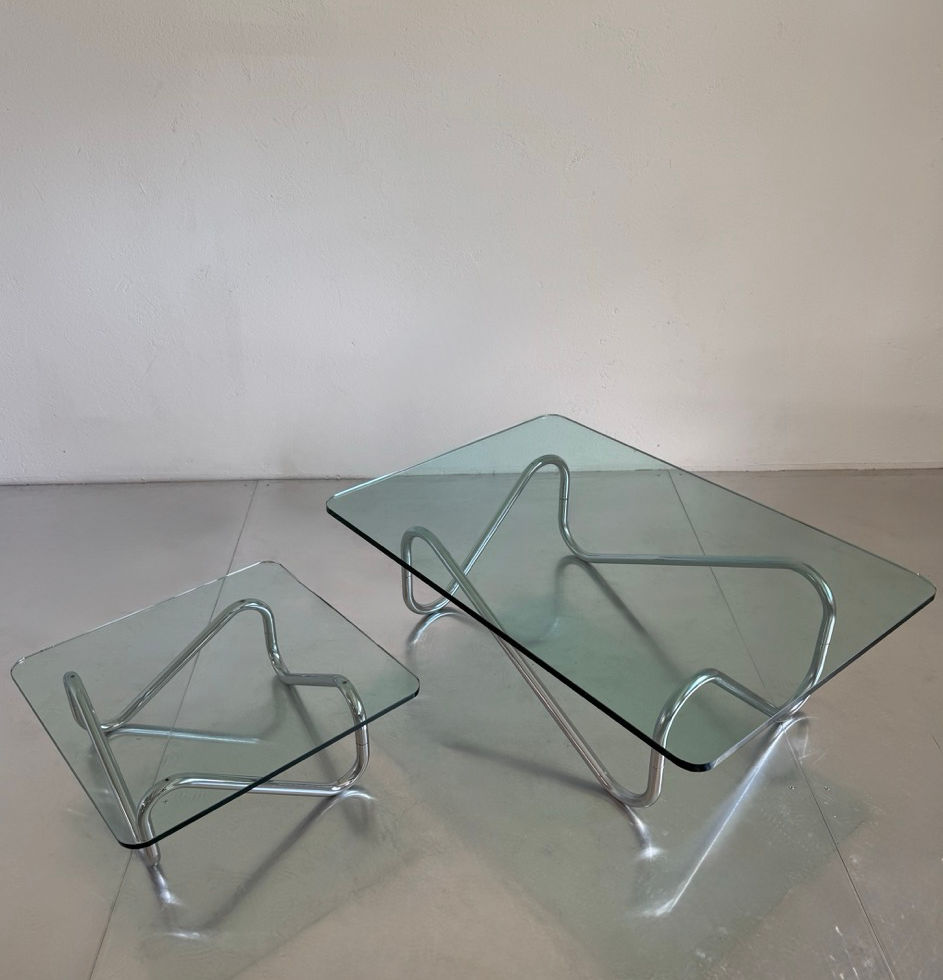Set of two original vintage French tubular steel nesting coffee tables in a minimalist space