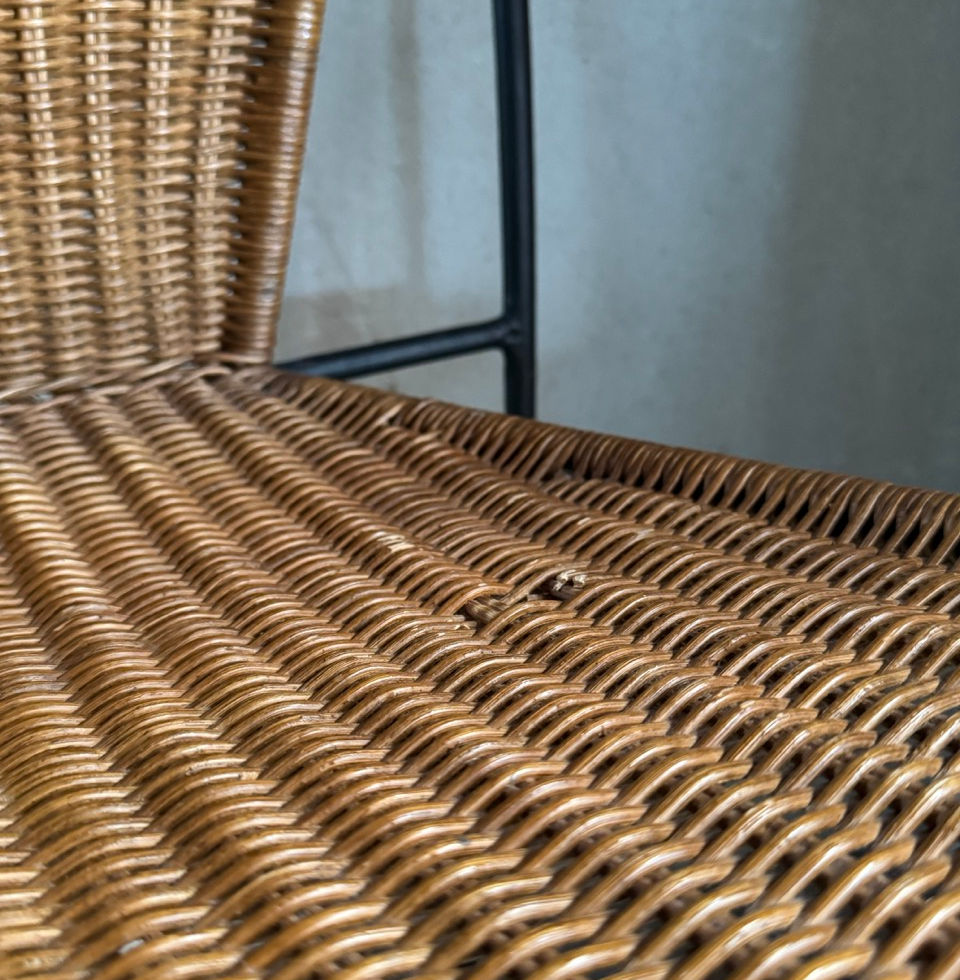 Detailed view of the natural wickerwork texture highlighting a minor vintage wear mark