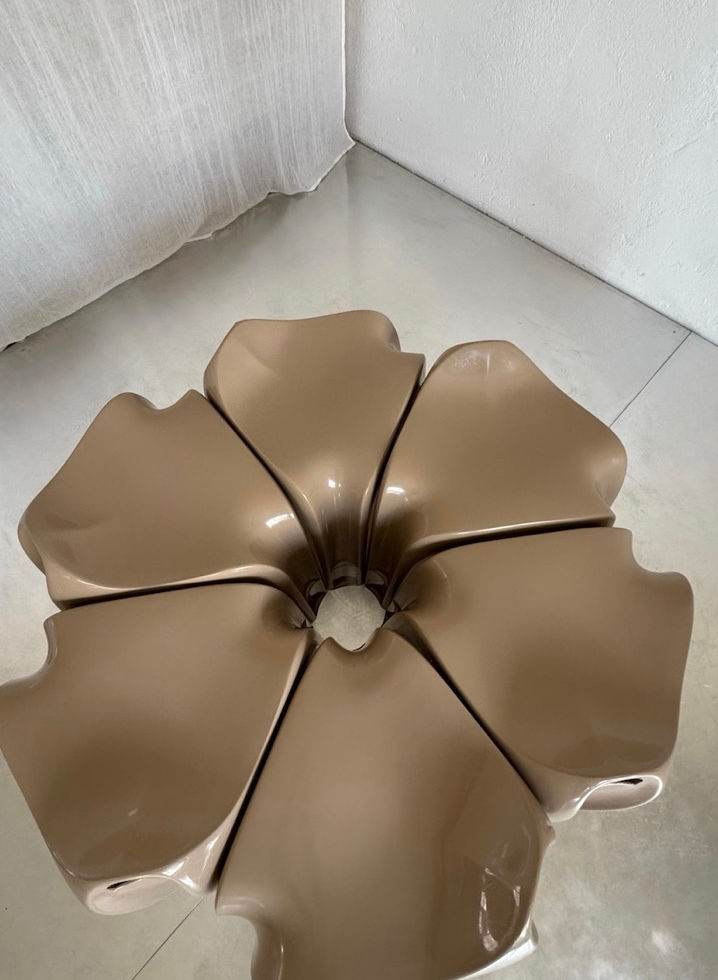 Top view of six Casalino stools arranged in a circular flower formation showcasing their Space Age silhouette