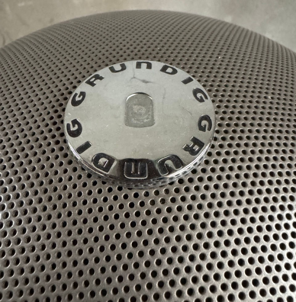 Original vintage Grundig logo emblem badge on top of the Audiorama speaker