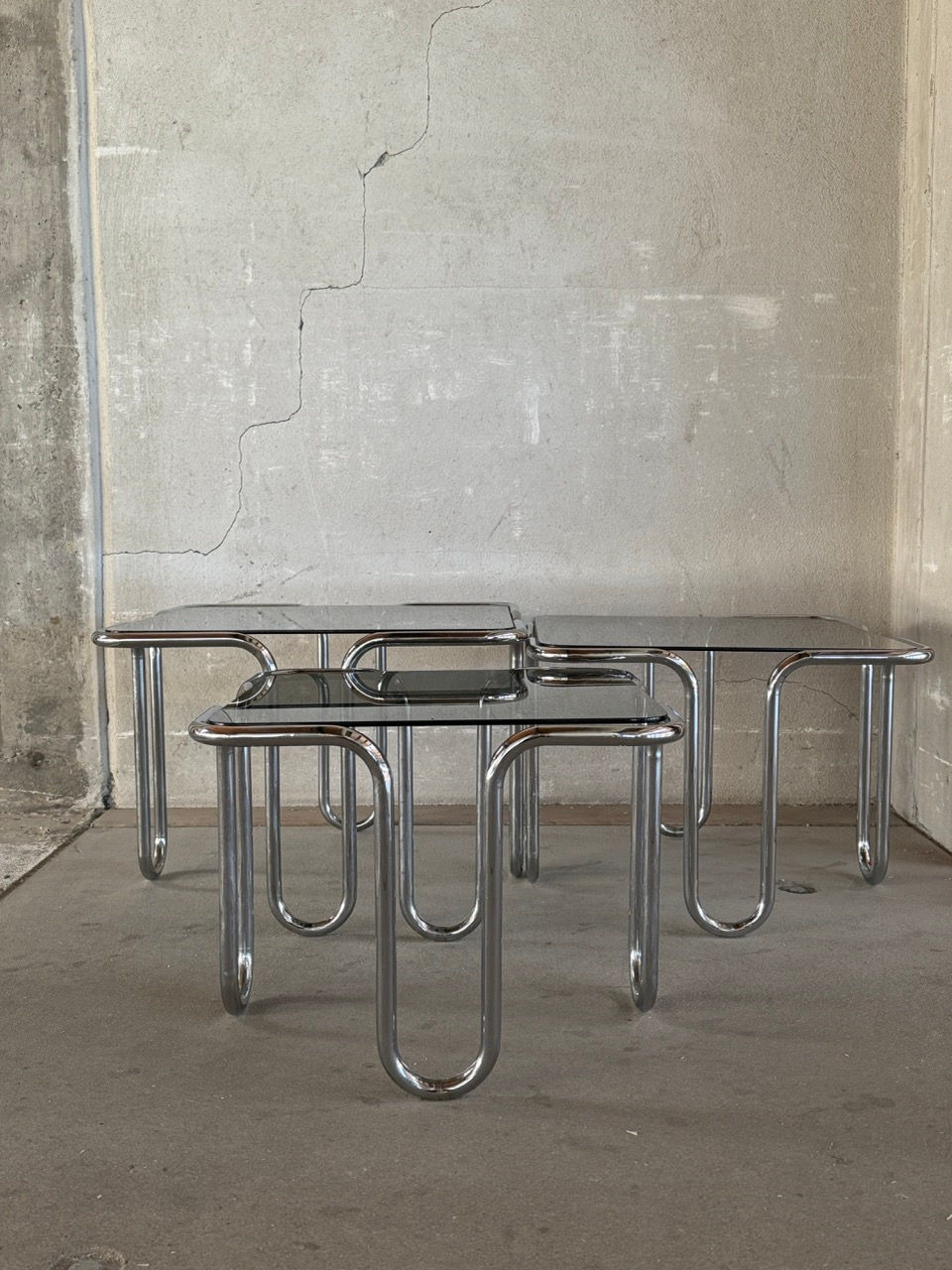 Rare set of 3 chrome and smoked glass nesting tables designed by Ezio Didone