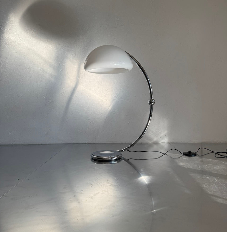 Minimalist Italian designer floor standing light in an architectural interior setting