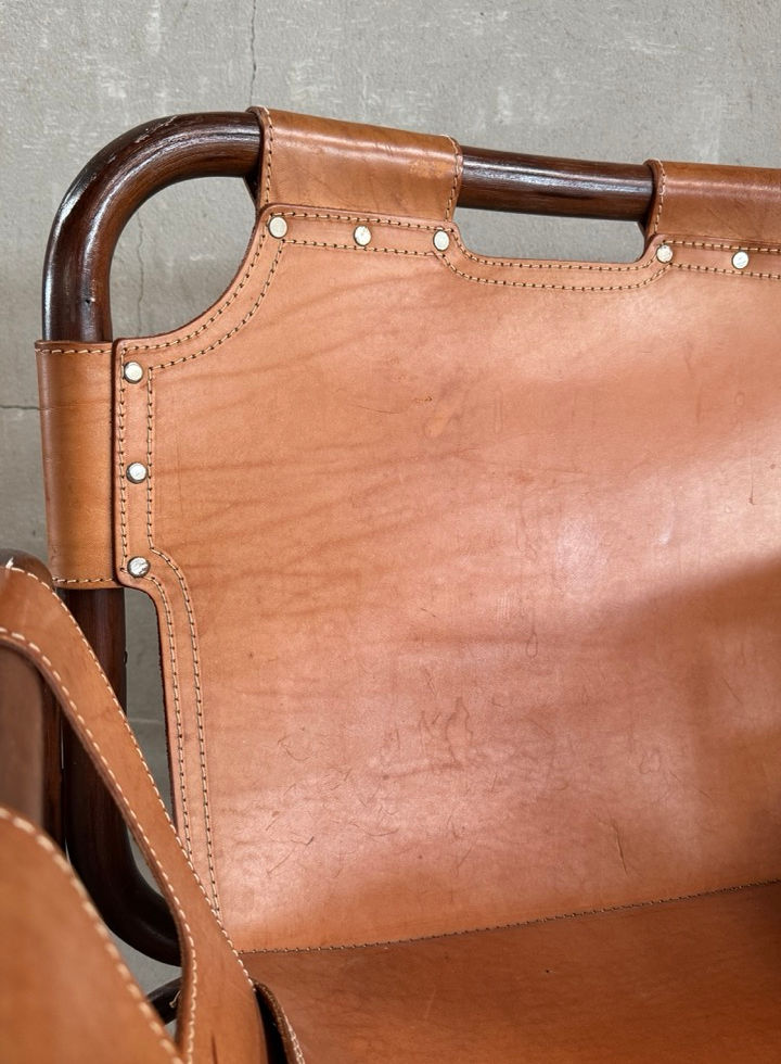 Detailed shot of the raw texture and authentic patina on the vintage saddle leather