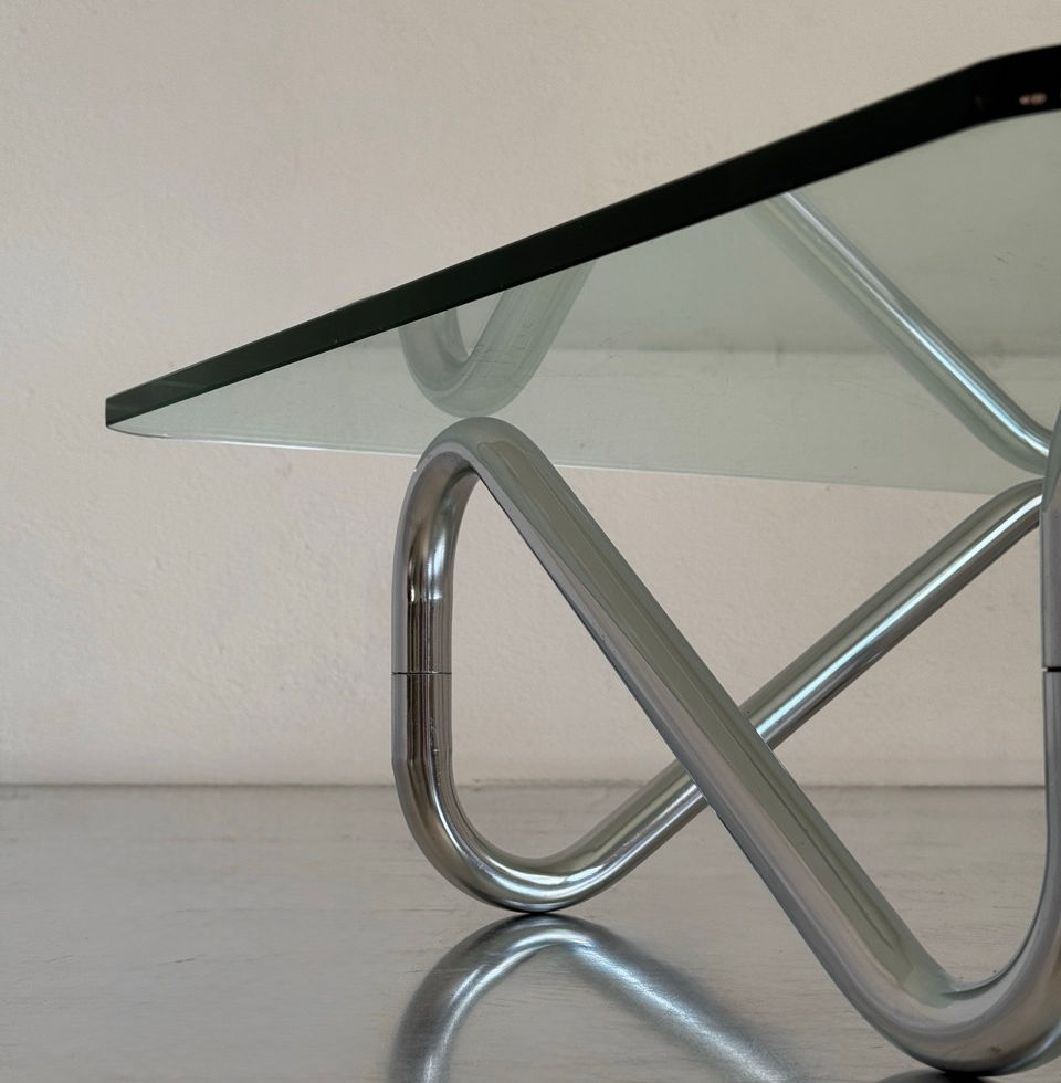Close-up detail of the heavy chrome-plated modernist tubular steel frame structure