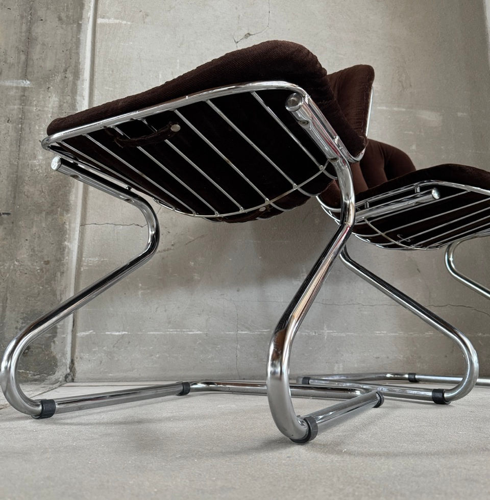 Low-angle perspective highlighting the dynamic cantilever chrome steel frame design