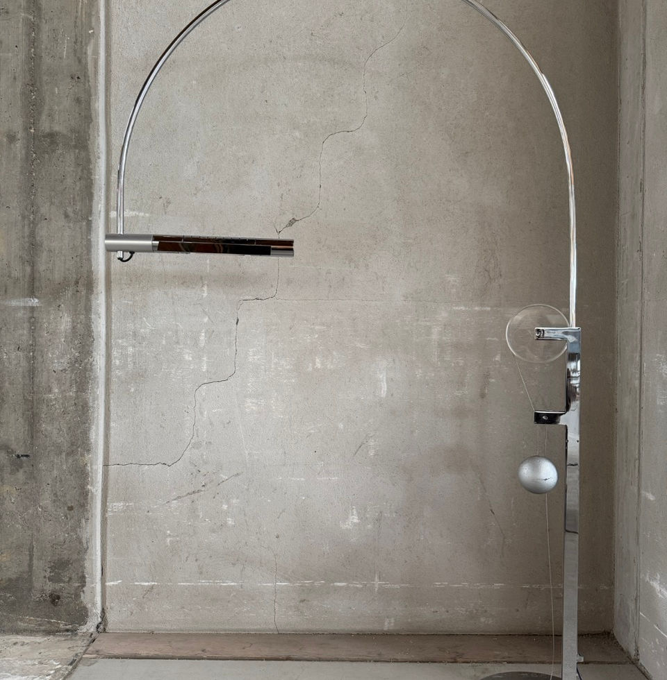 Height adjustable designer halogen floor lamp with iconic silver balance weight
