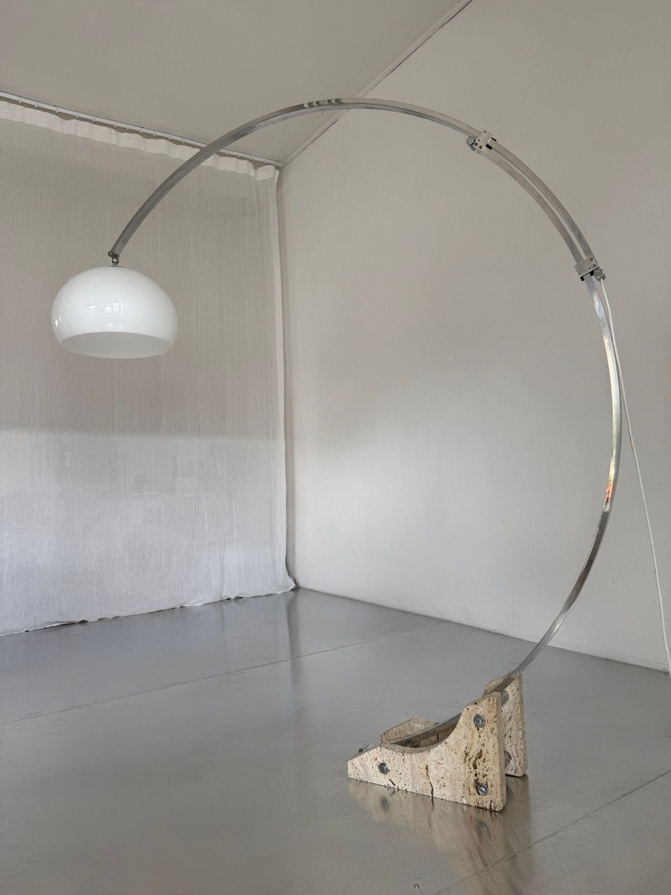 1970s vintage arc floor lamp with travertine base and extended aluminium arm