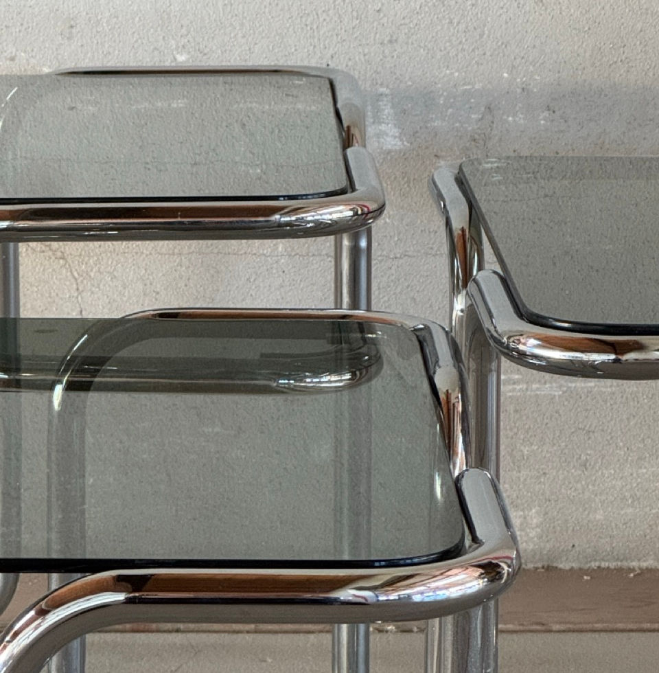 Detailed side profile showing the clean geometric forms and chrome-plated frame