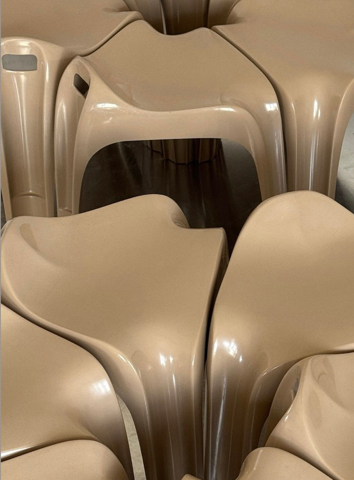 Detailed close-up of vintage Casalino stools by Alexander Begge for Casala showing the sleek molded plastic contours