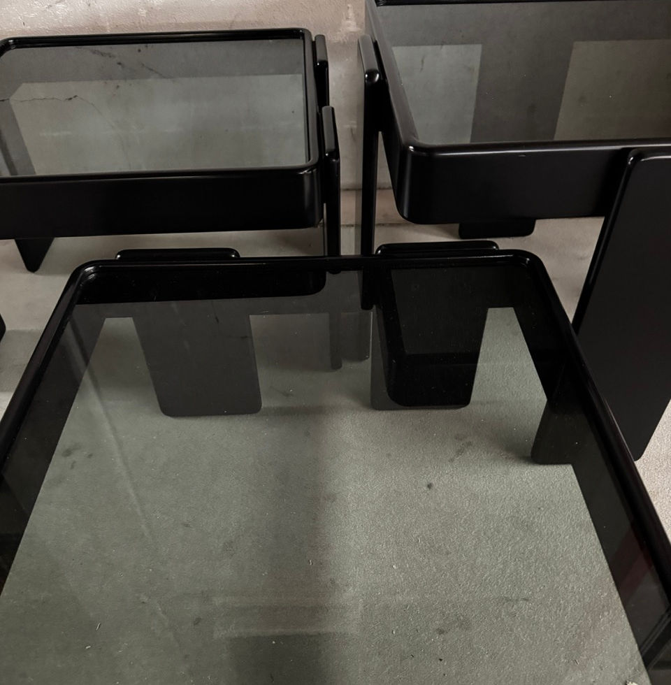 Macro perspective of the dark smoked glass material and minimalist joinery