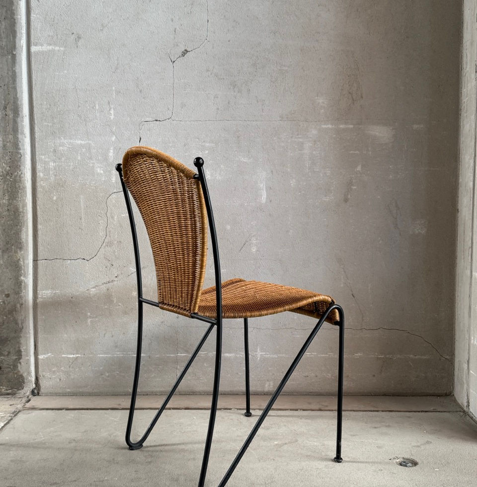 Side view of the mid-century modern wicker dining chair without armrests