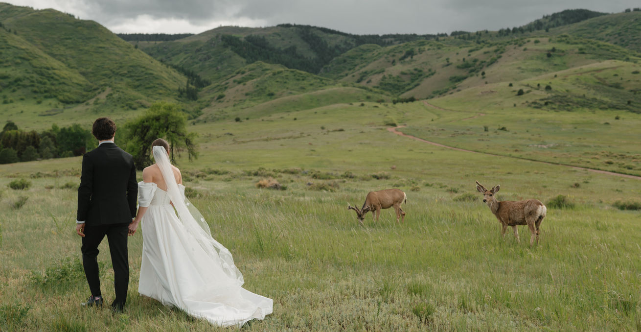 Bride and Groom walking hand in hand at a Colorado wedding