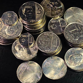 Modern Philippine coins and denominations including 1 piso, 5 piso, and centavo coins with portraits, mint details, and design features