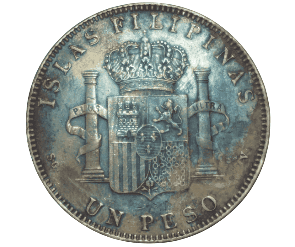 Eye-level view of a silver Alfonso XIII coin with intricate design