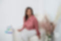 image of Dr. Daniely smiling and sitting on a couch