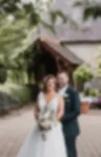 Bride and groom smiling together outdoors at their wedding venue, captured by JGC Videography