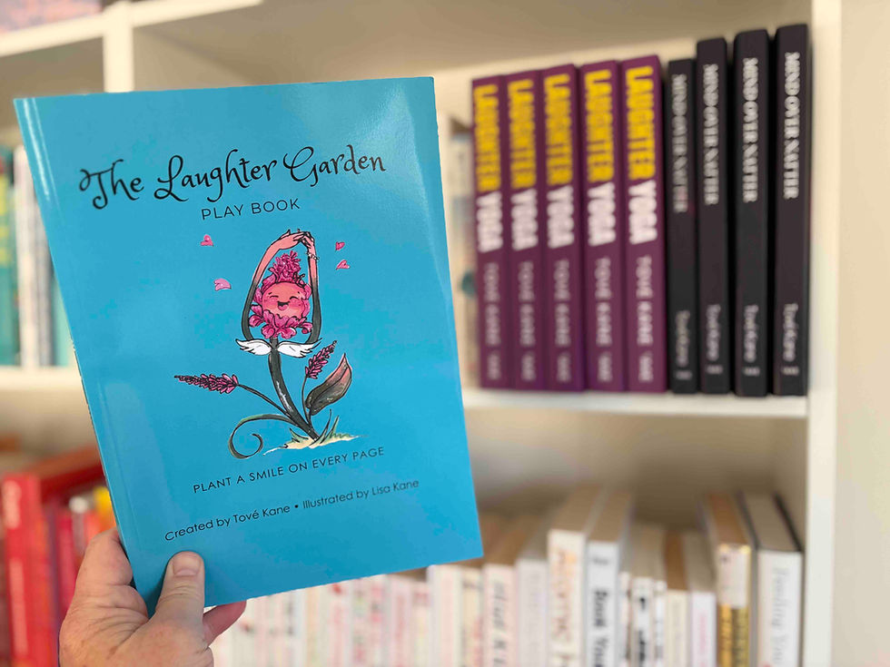 Thumbnail: The Laughter Garden Play Book held in front of a shelf of Laughter Garden books