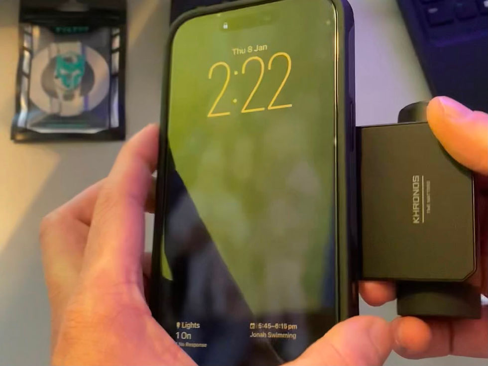 Tilta Khronos camera grip being attached in portrait orientation to an iPhone in the protective case.