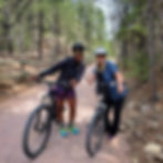 Two cyclists stop of a selfie along the Mickelson Trail