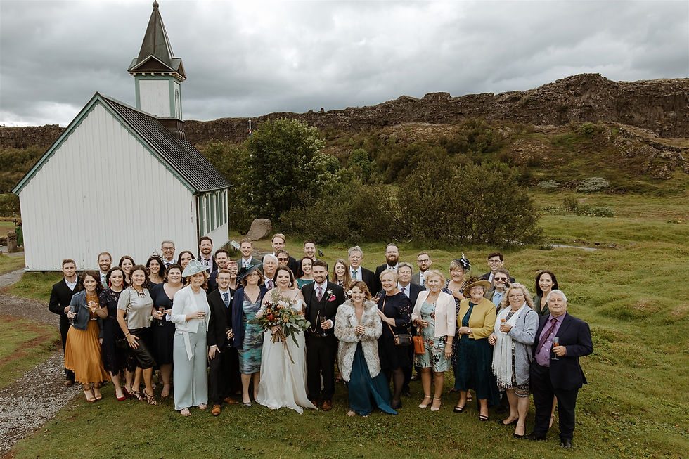 Wedding guests outside Thingvellir Church in the National Park. Iceland Wedding photo by Styrmir & Heiddis