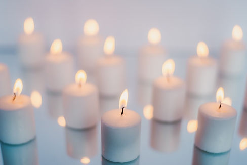 Image courtesy of Unsplash, close up of small lit candles