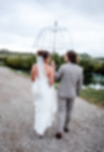 Wedding photo op in the rain, Central IL wedding venue, Bride & groom, Wedding venue near me Champaign IL