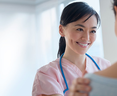 Nurse comforting patient