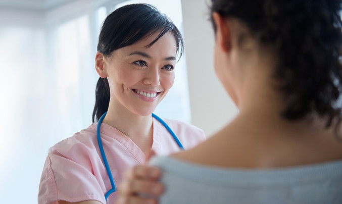 Nurse comforting patient