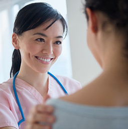 Nurse comforting patient
