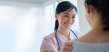 Nurse comforting patient